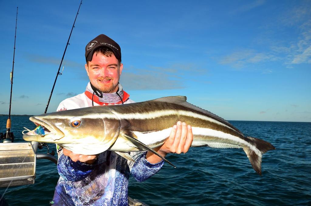 Lee with a solid cobia taken from the shadows of a giant leatherback turtle on a metal blade lure. © Lee Brake